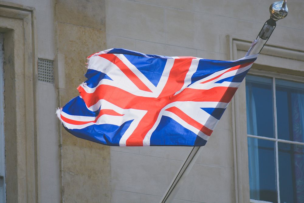Waving UK flag. Original public domain image from Wikimedia Commons