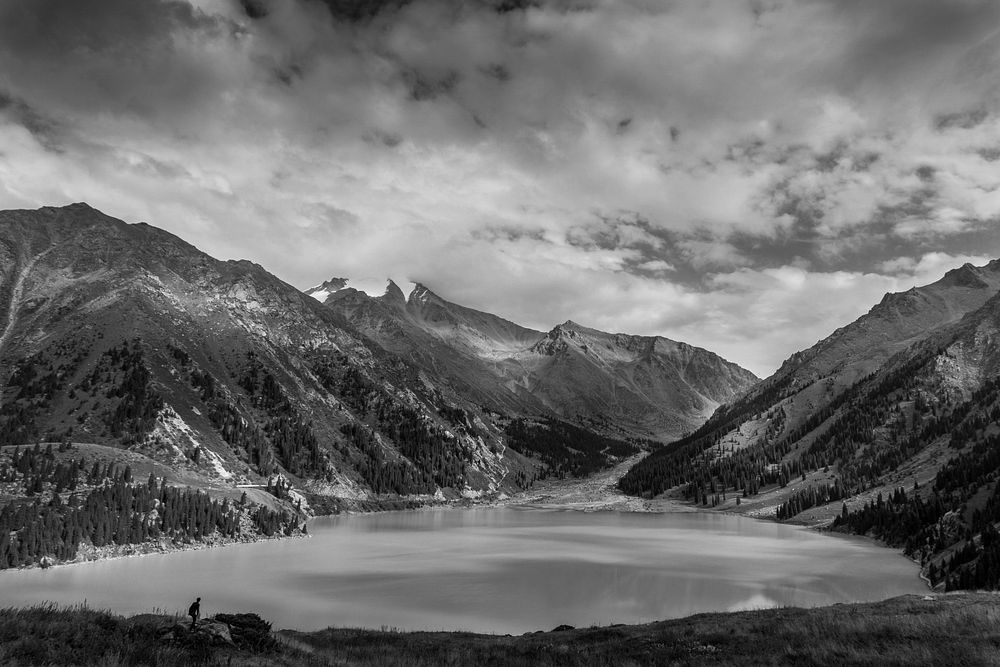 Black and white shot of beautiful mountain lake with cloudy sky in Kazakhstan. Original public domain image from Wikimedia…