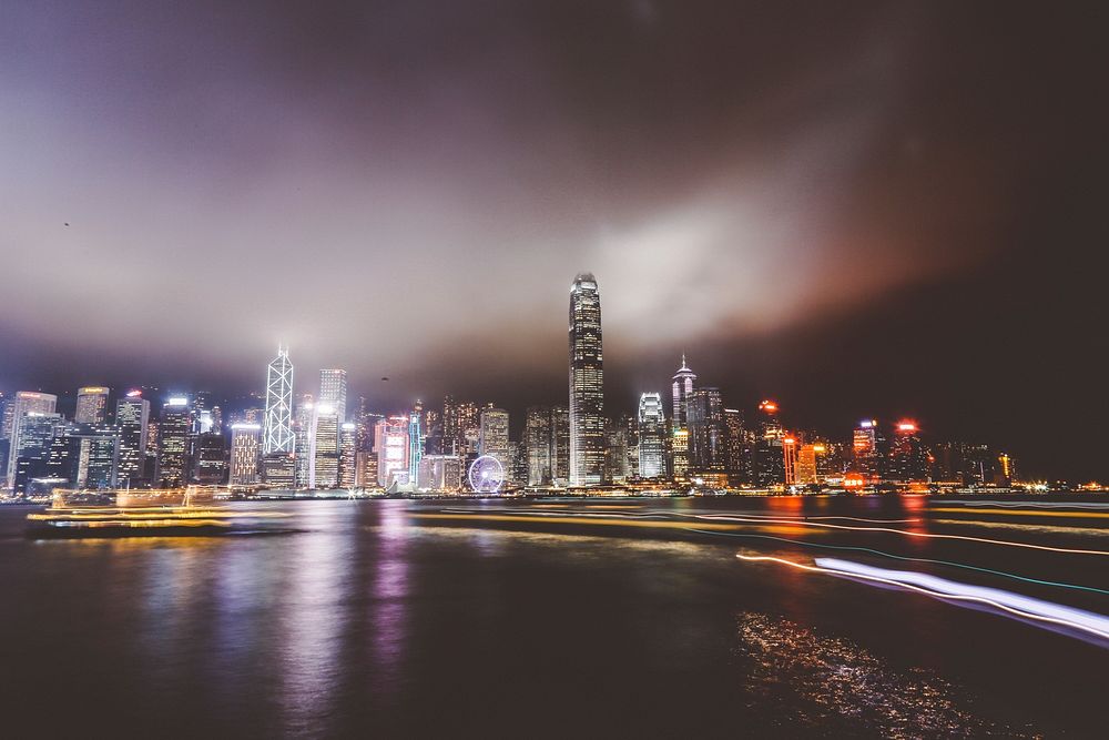 City skyline on the waterfront downtown on a foggy night. Original public domain image from Wikimedia Commons