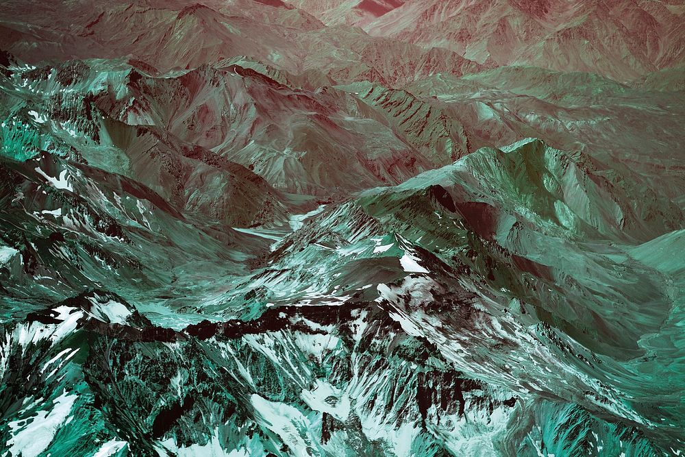 A green-hued aerial shot of the sharp ridges in the Andes. Original public domain image from Wikimedia Commons