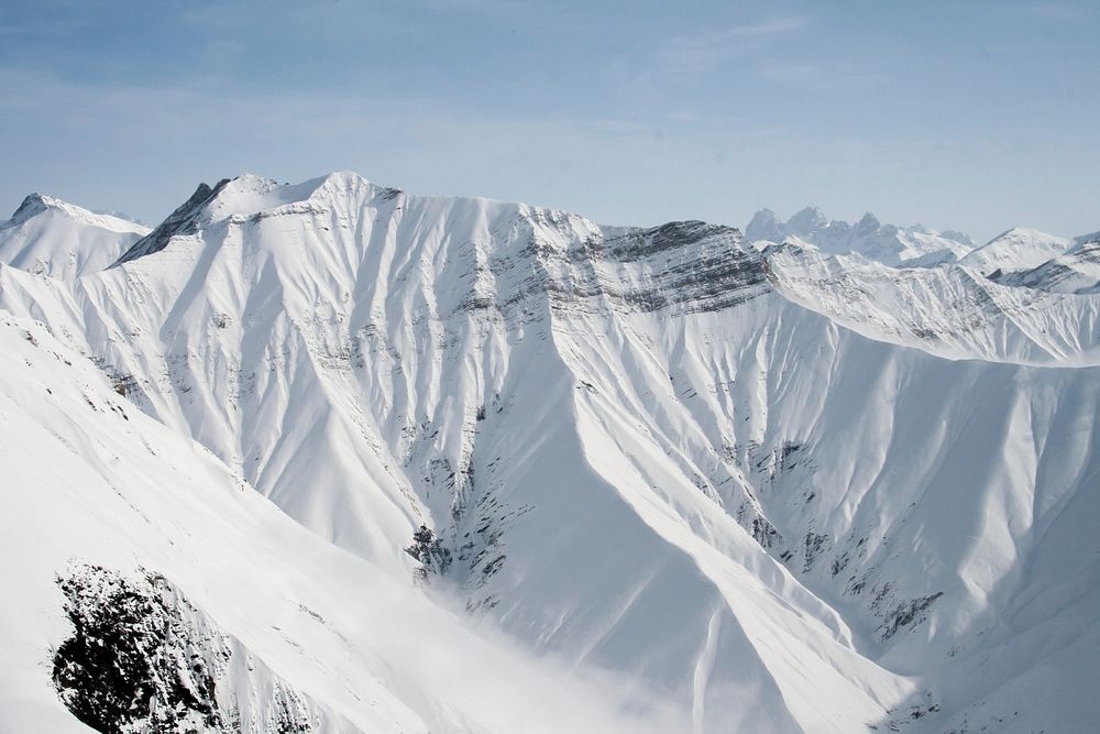 Snow blankets a mountain in Gudauri in Georgia. Original public domain image from Wikimedia Commons