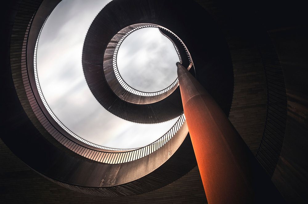 A perspective from the bottom of a spiral stair building architecture in Antinori nel Chianti Classico. Original public…