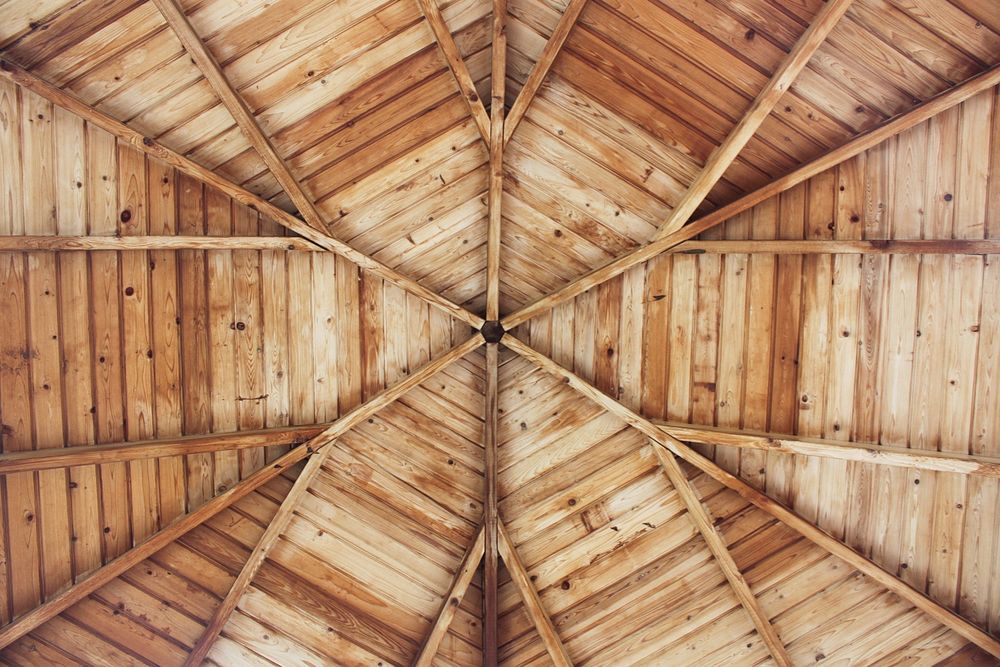 The symmetrical details of a wooden structure's ceiling.. Original public domain image from Wikimedia Commons
