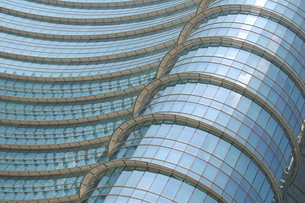 Curved glass facade of a modern building. Original public domain image from Wikimedia Commons