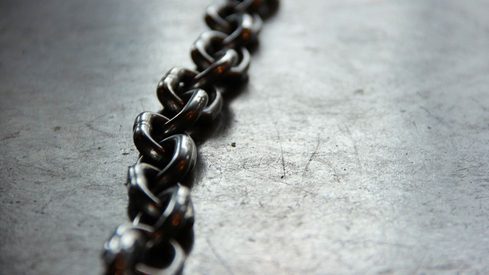 Macro shot of a chain link.. Original public domain image from Wikimedia Commons
