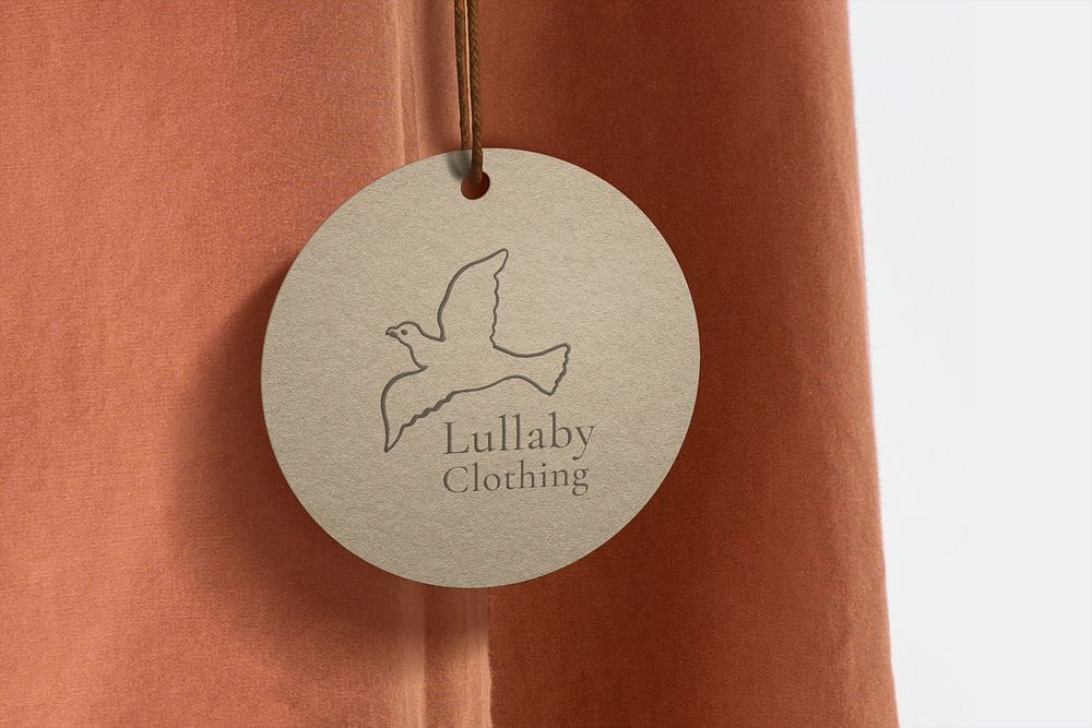 Label tag mockup, organic paper with bird logo for fashion business psd