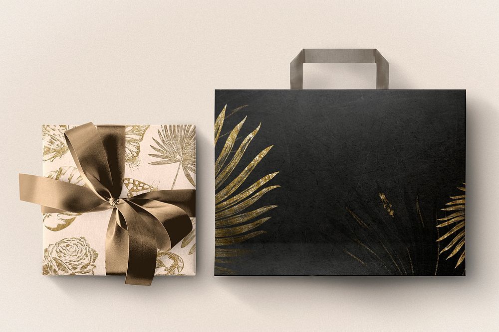 Black shopping bag & gift box, gold glitter botanical design on cream background