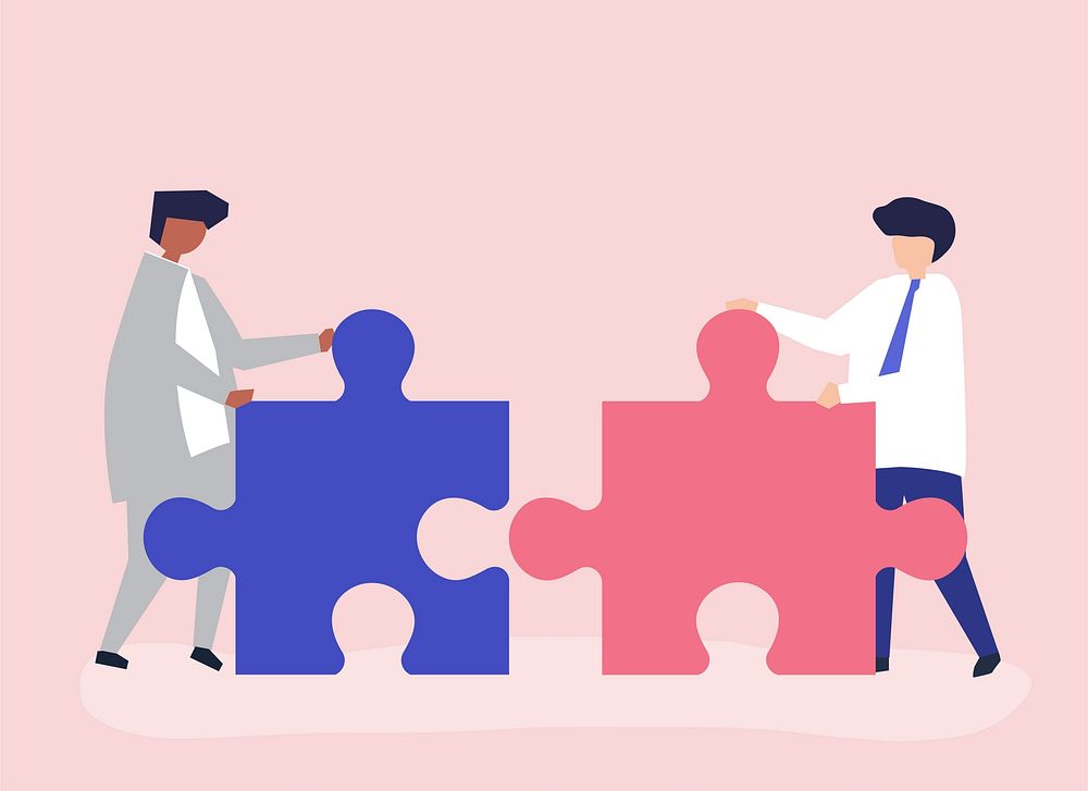 Colleagues connecting jigsaw pieces together