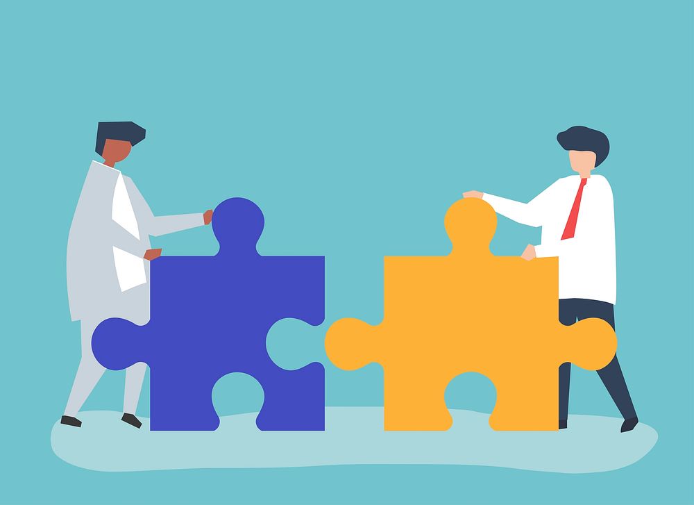 Colleagues connecting jigsaw pieces together