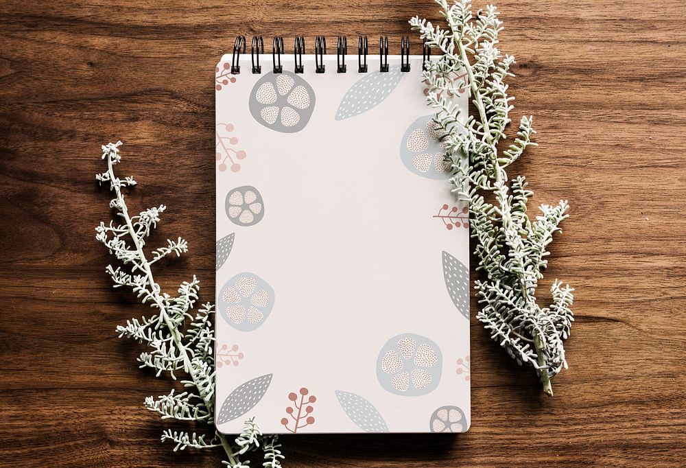 Doodle patterned notebook on a wooden table illustration
