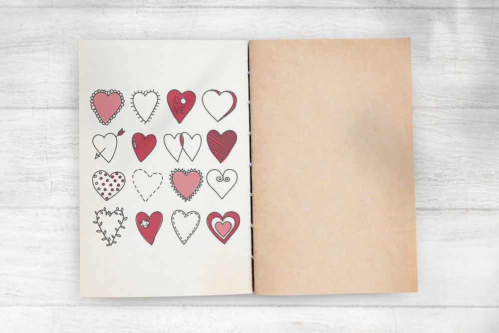 Hand drawn heart doodle vector on a notebook