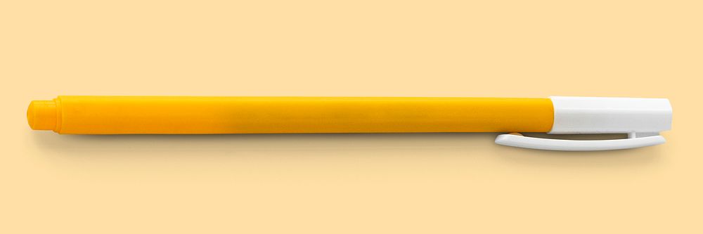Yellow pen with cap isolated on yellow background