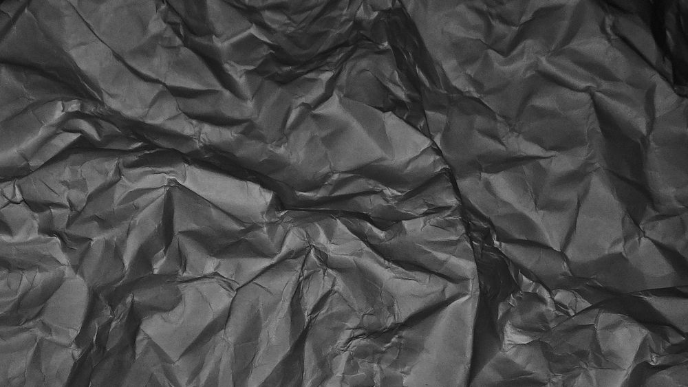 Crumpled black paper desktop wallpaper, high definition background