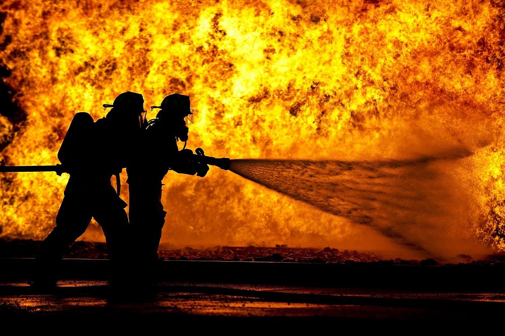Free firefighters extinguishing flames image, public domain CC0 photo.
