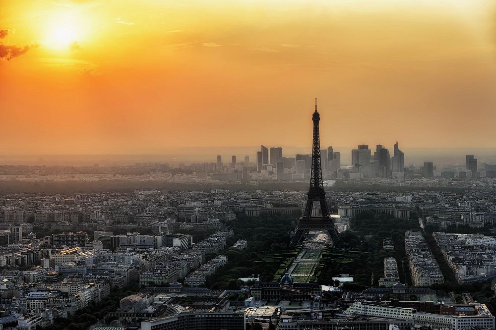 Free Eiffel Tower and Paris cityscape during sunset photo, public domain building CC0 photo.