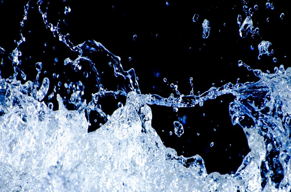 Free water splash on black background image, public domain CC0 photo.
