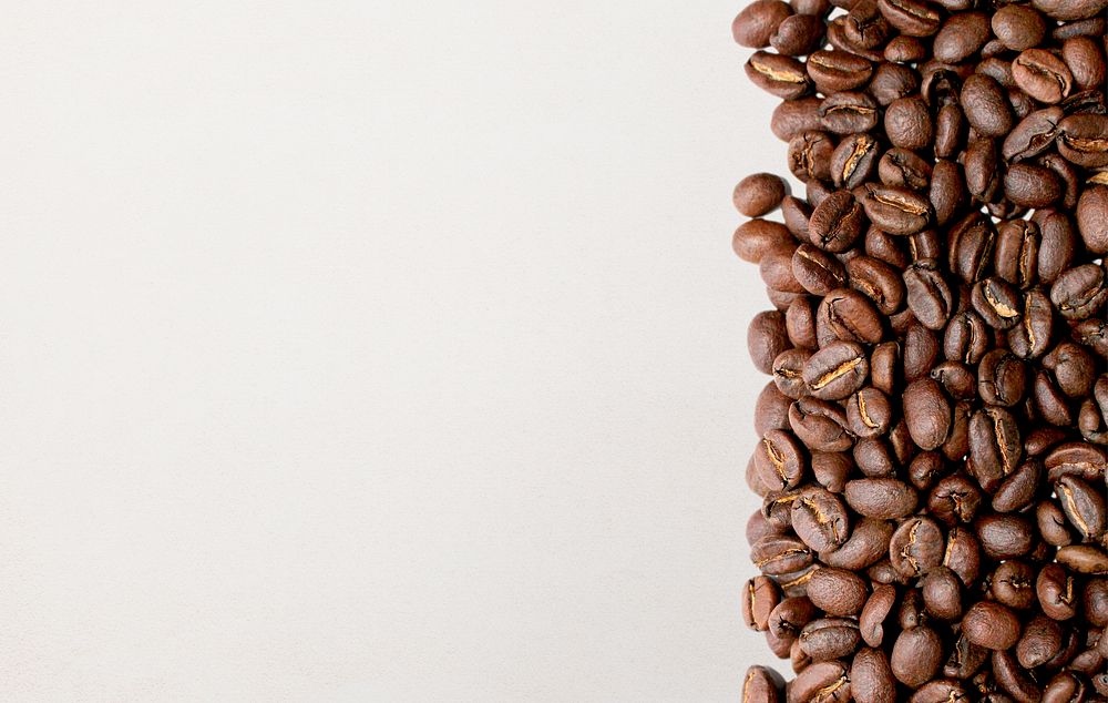 Coffee beans border, beige background