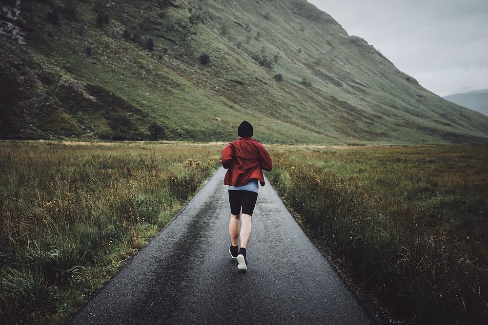 Man jogging through the Highlands