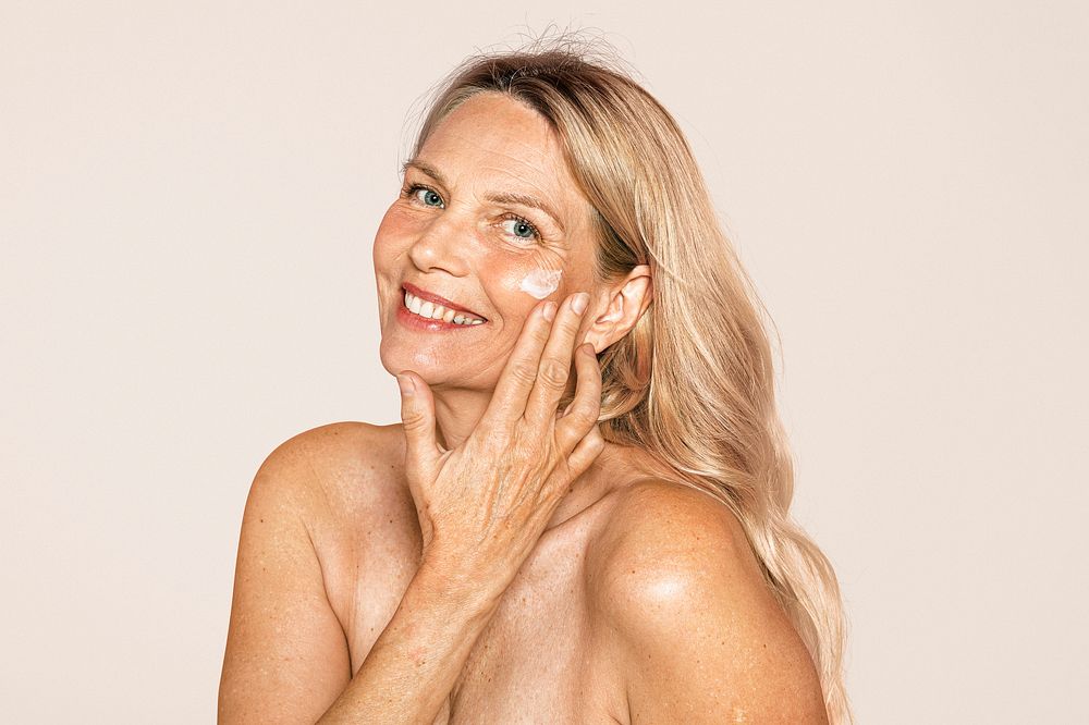 Woman's anti aging skincare routine, pink background