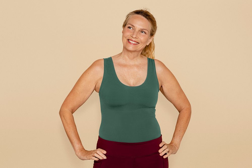 Healthy and mature woman in yoga outfit 