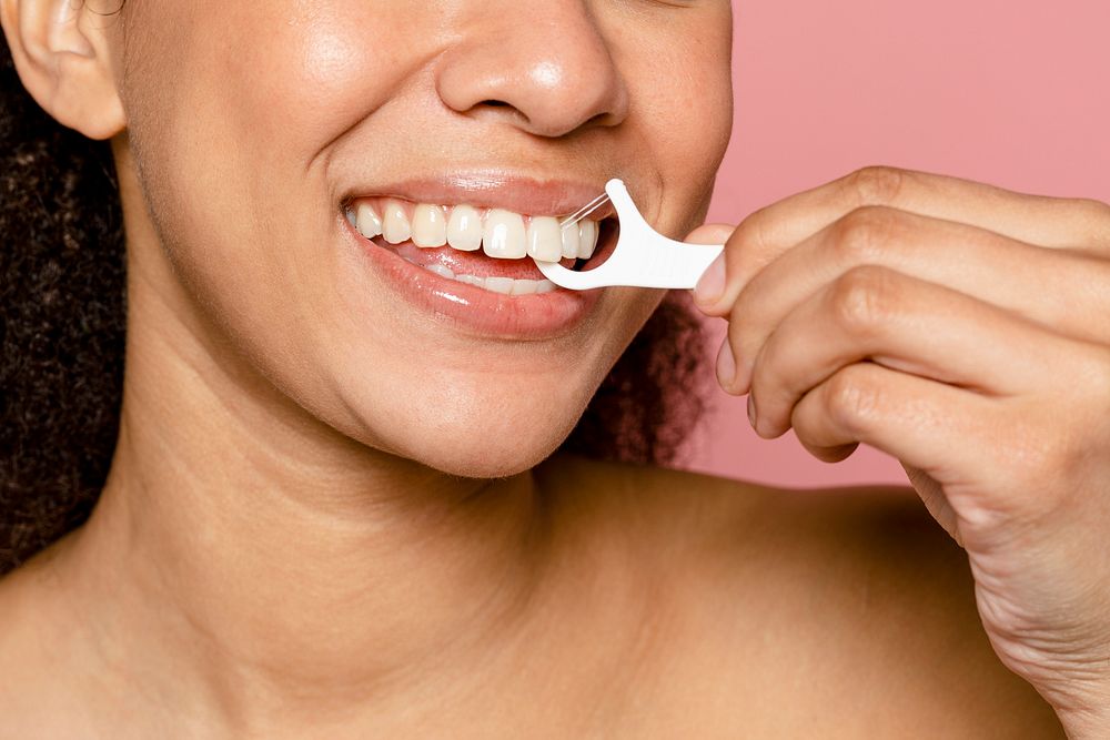 Dental care with floss stick for a healthy smile