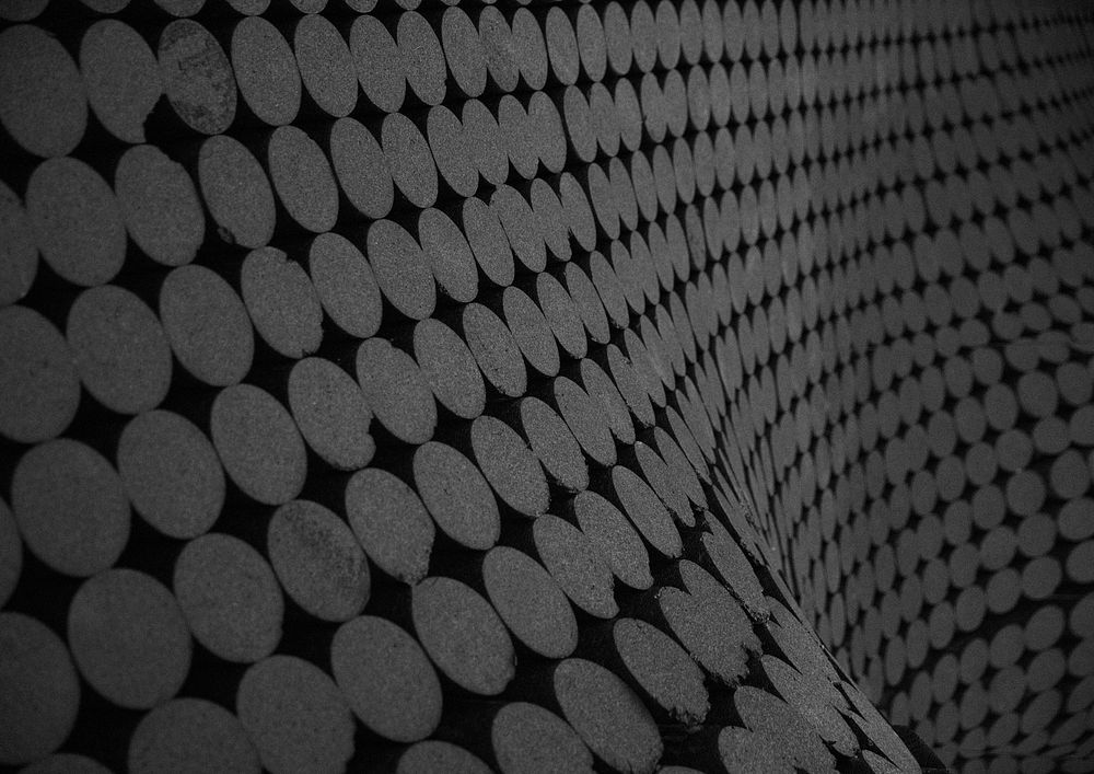 Abstract wavy wall background, black circles texture