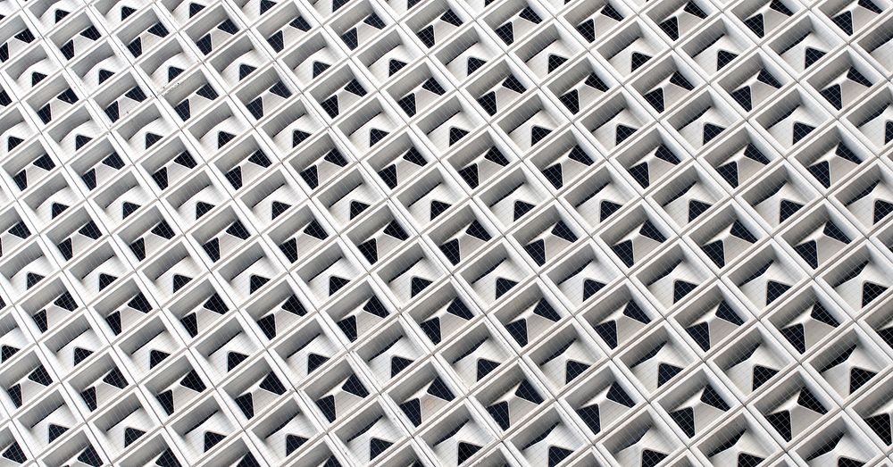 Geometric hole pattern background, abstract architectural texture