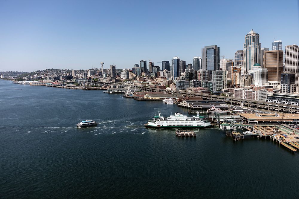 Aerial view of the Seattle, Washington, waterfront and downtown skyline, with a focus on the ferry terminal in which many of…