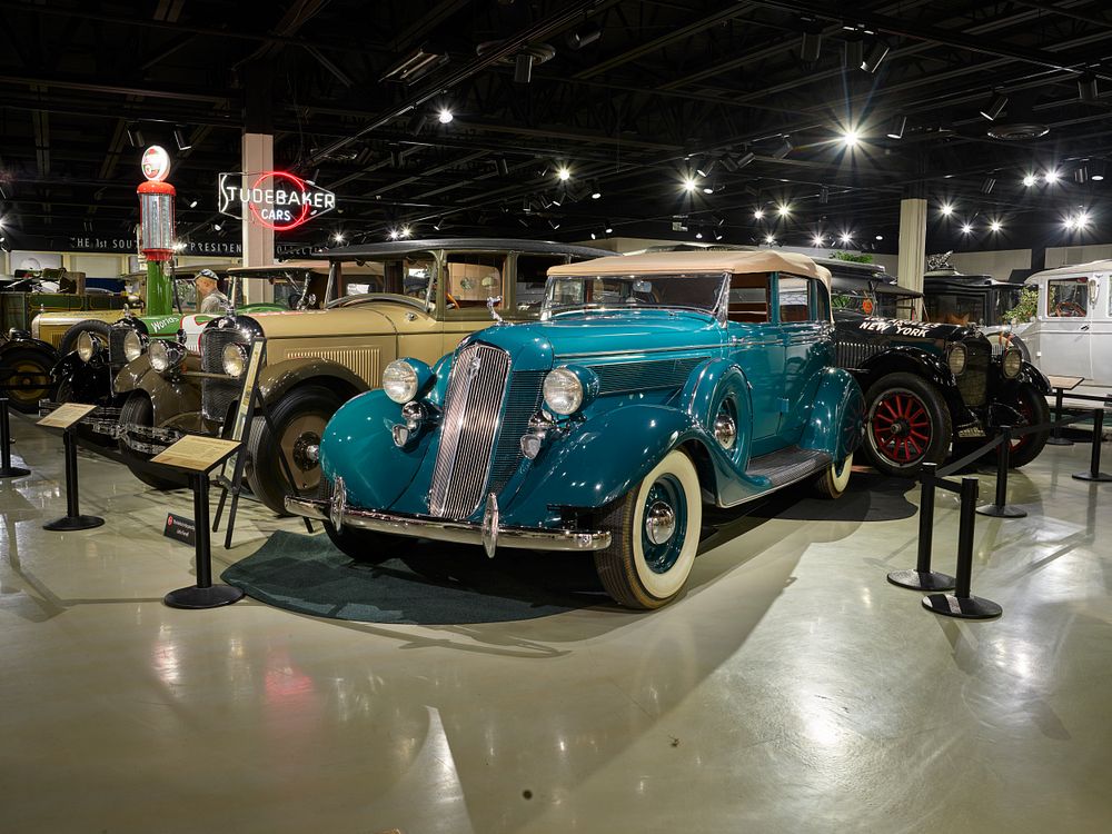 A 1935 Studebaker President convertible sedan (in aqua) at the Studebaker Museum in South Bend, Indiana.  During wartime…