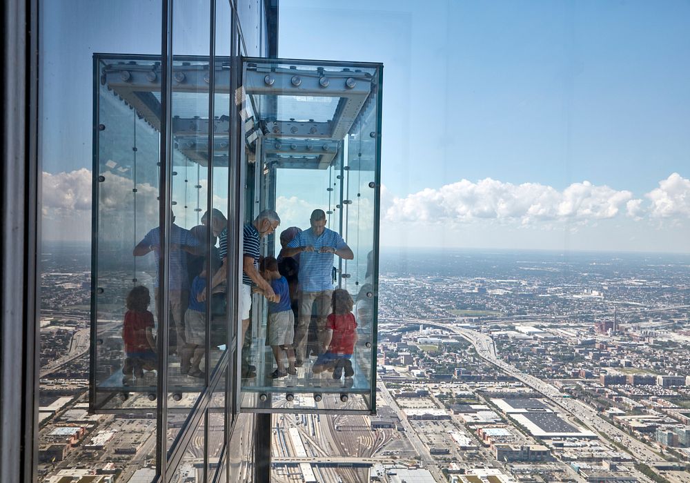 Visitors (and presumably some people who work in the building) get a spectacular view of the city from a glass elevator…