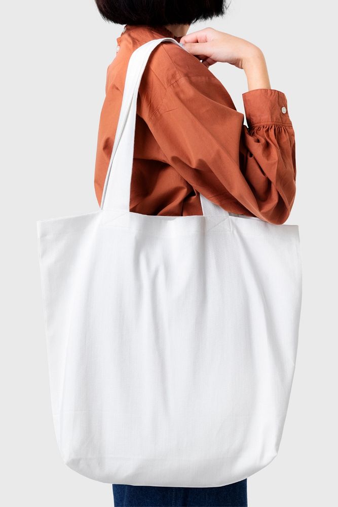 Tote bag mockup, female model, editable design