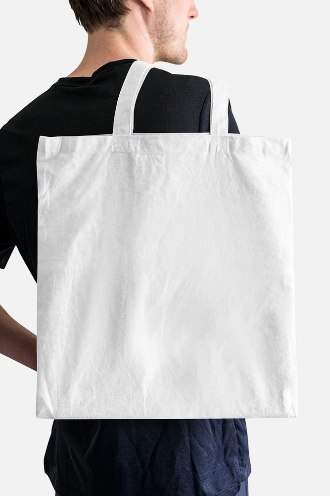 Editable tote bag mockup, male model design