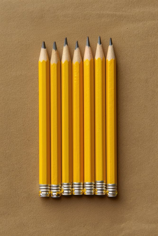Yellow pencils arranged sideways ammunition weaponry bullet.