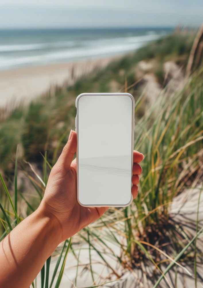 Screen phone mockup outdoors photo beach.