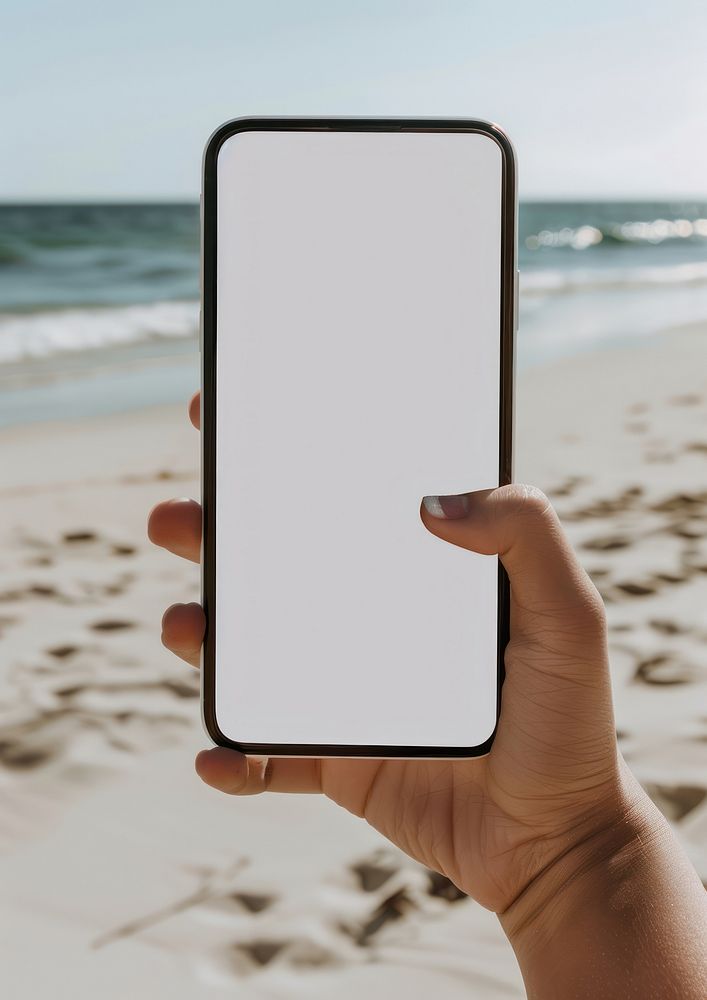 Screen phone mockup outdoors beach ocean.