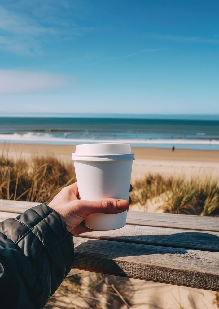 Coffee cup mockup beach ocean sea.