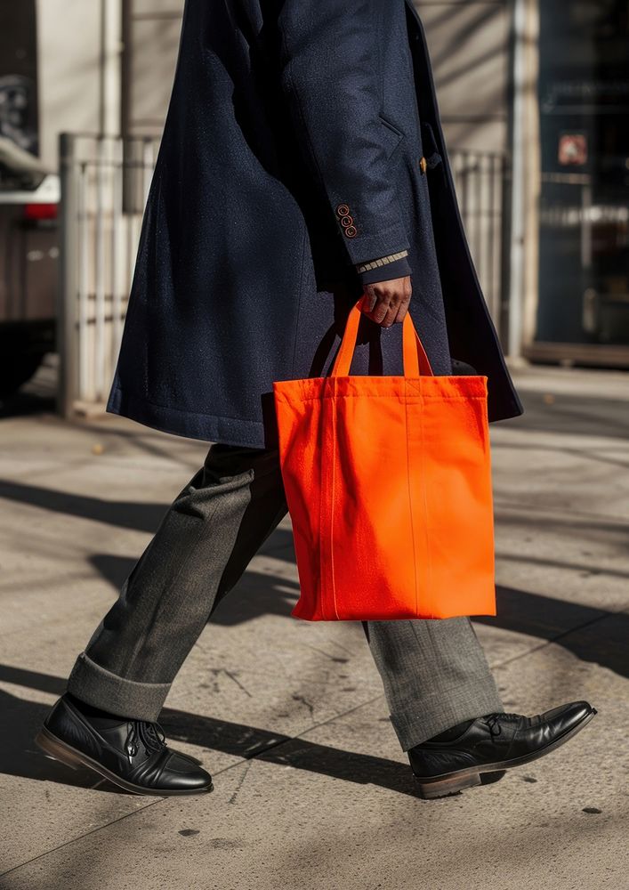 An orange tote bag coat shoe accessories.