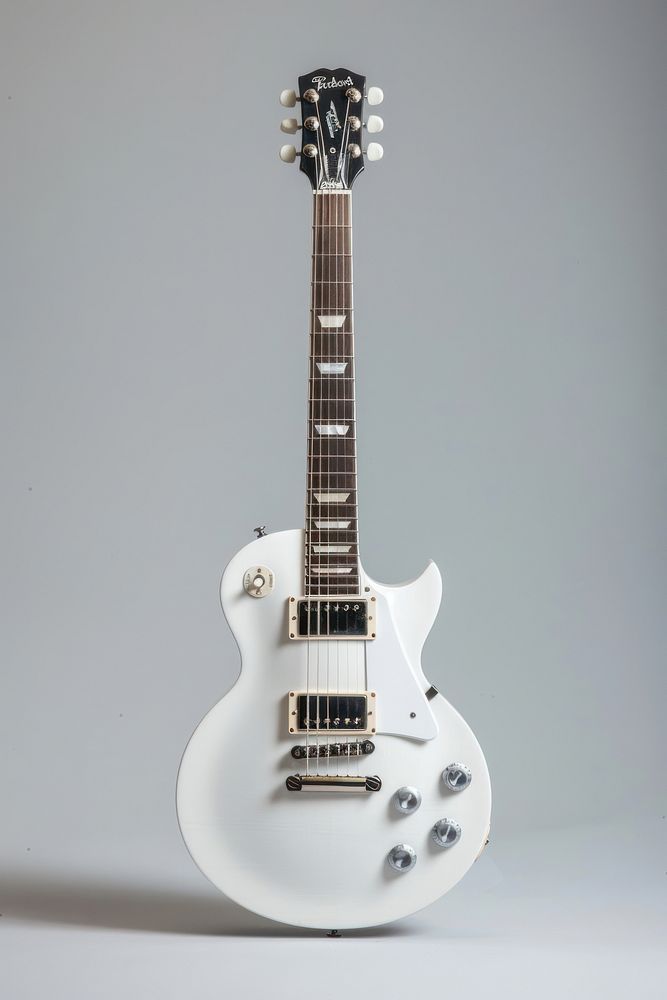 LP shape guitar metallic white body with silver electric guitar musical instrument.