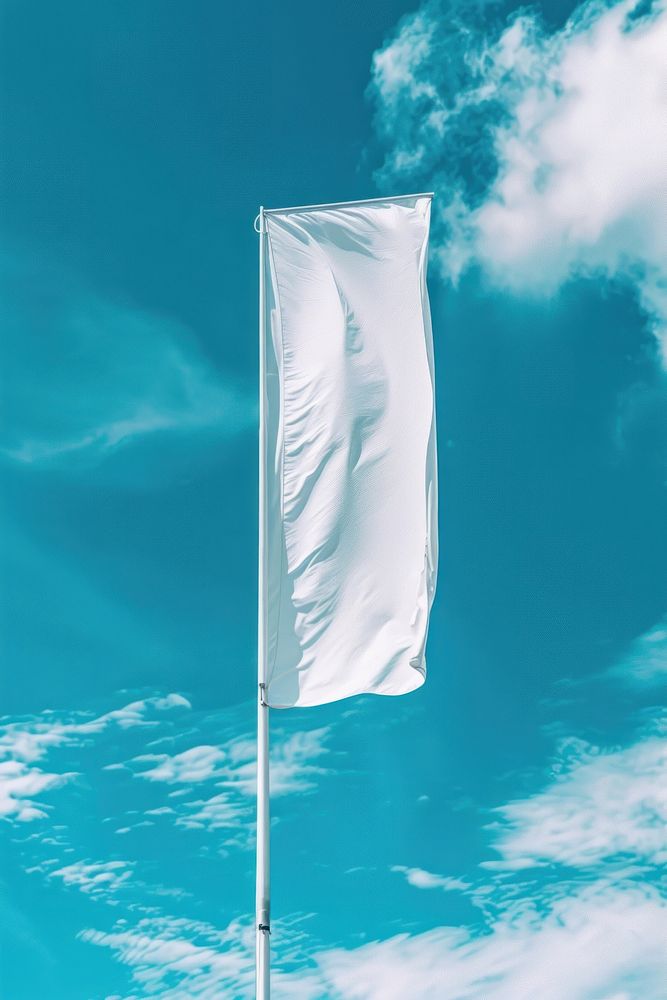 Empty white vertical banner against blue sky without clouds flag.