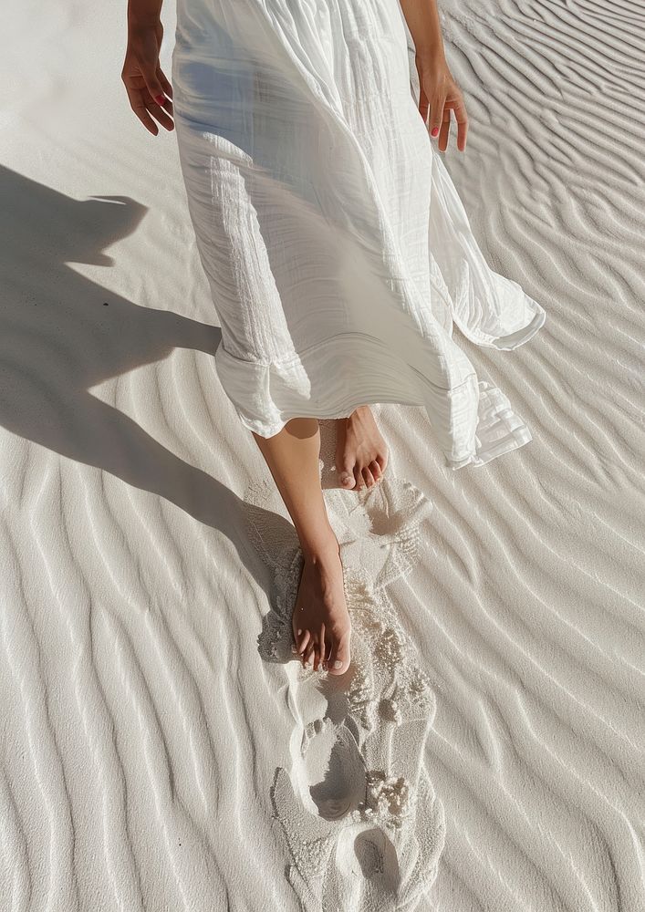Footprints in the sand female beachwear clothing.