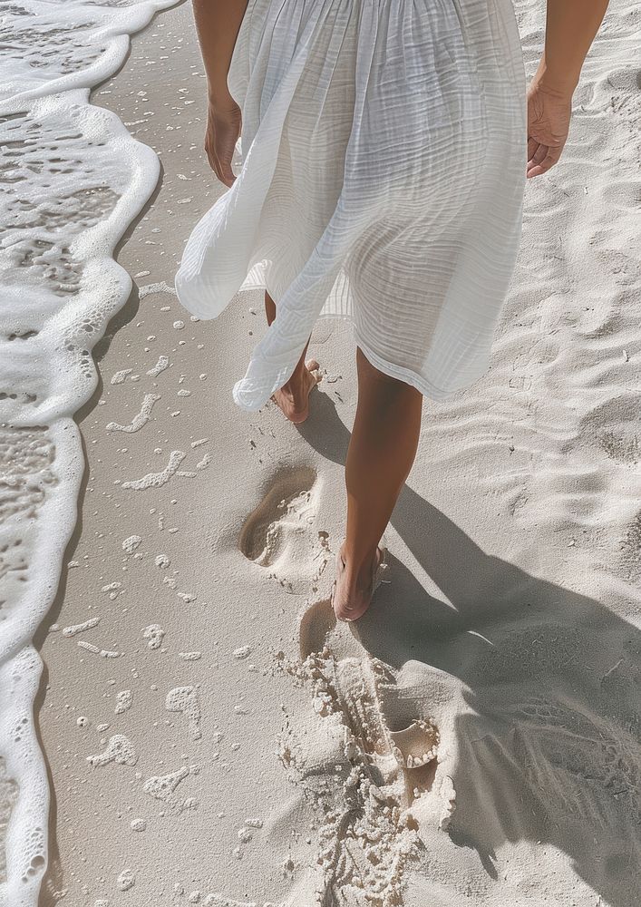 Footprints in the sand beachwear clothing outdoors.