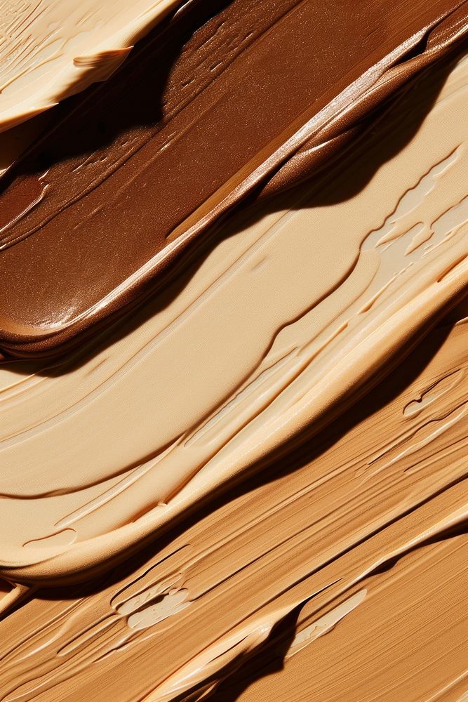 Liquid face foundation swatch in 3 shades of skin tone colors dessert cream creme.