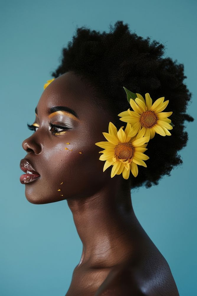 African american woman with bloming sunflowers on her ear photo photography asteraceae.