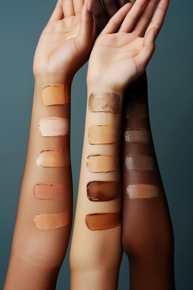 Liquid face foundation swatch in shades of skin tone colors arm person human.