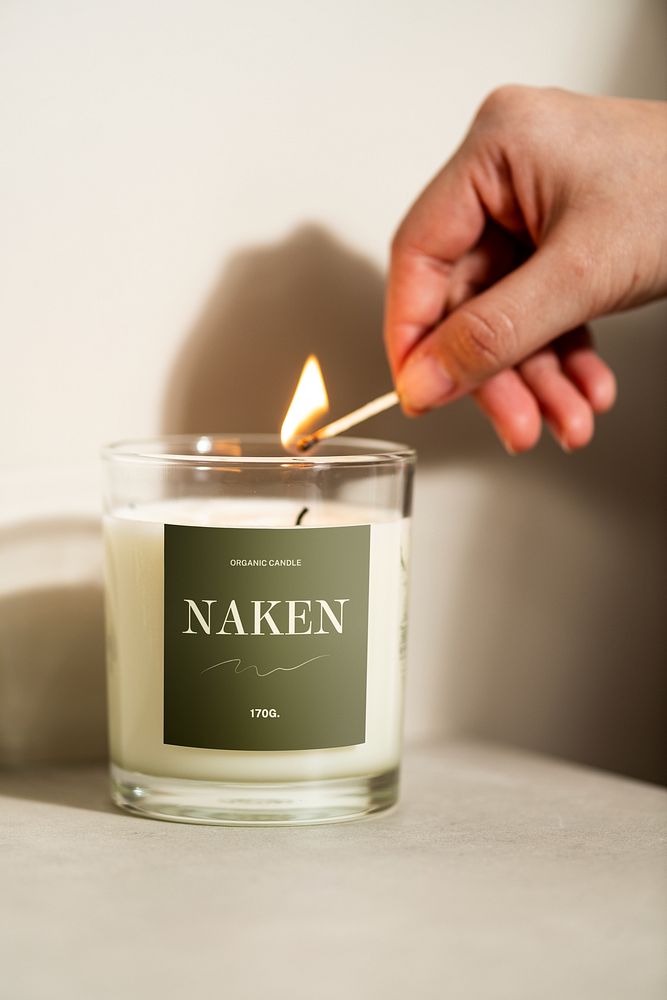 Woman lighting scent candle