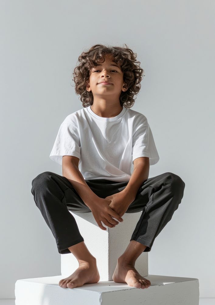 Boy wearing white t shirt mockup photography portrait sitting.