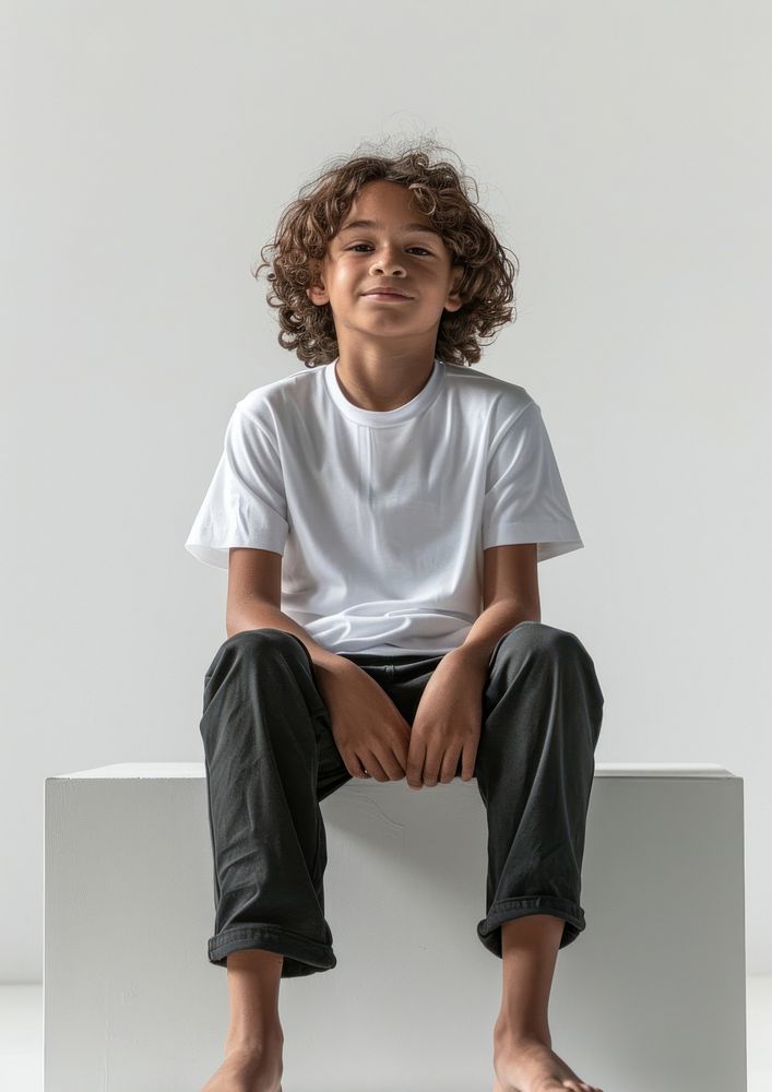 Boy wearing white t shirt mockup sitting person human.