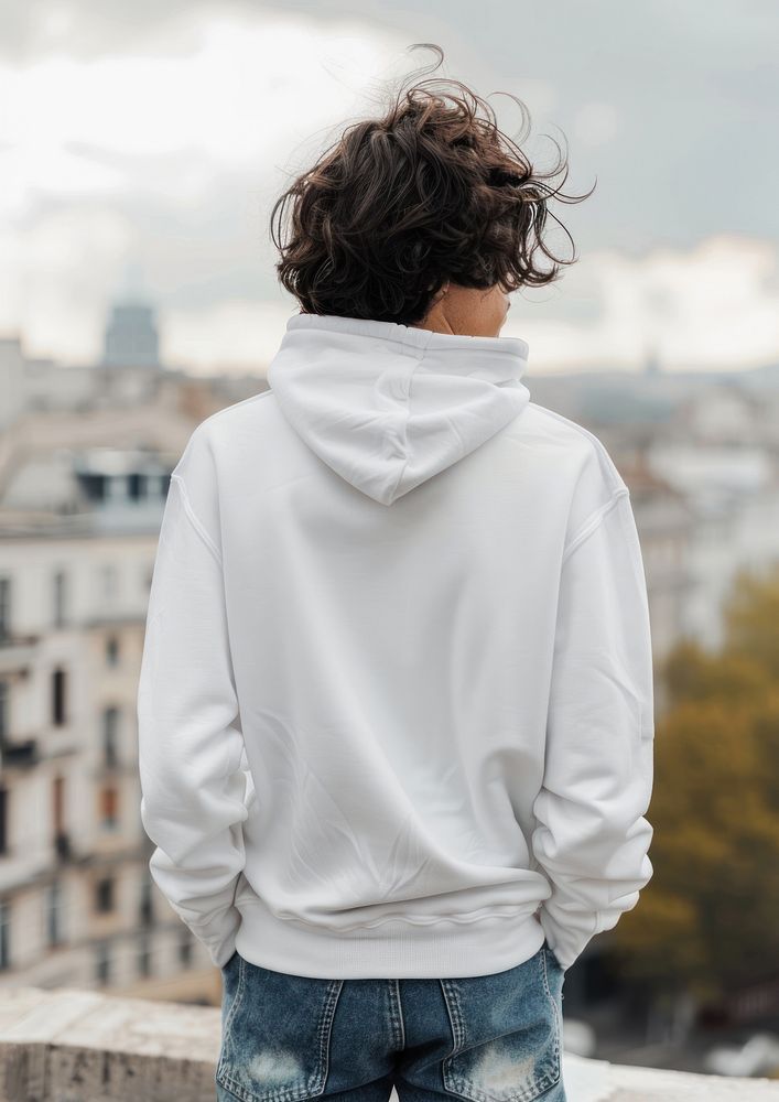 Young man wears blank white hoodie mockup sweatshirt clothing knitwear.