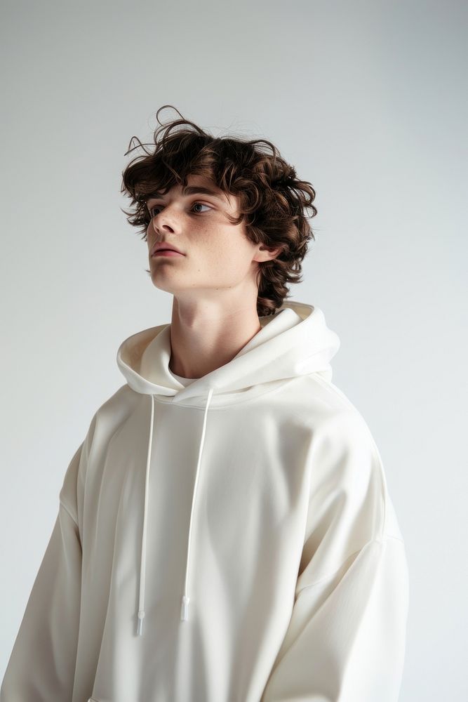 Young man wears blank white hoodie mockup photography fashion face.