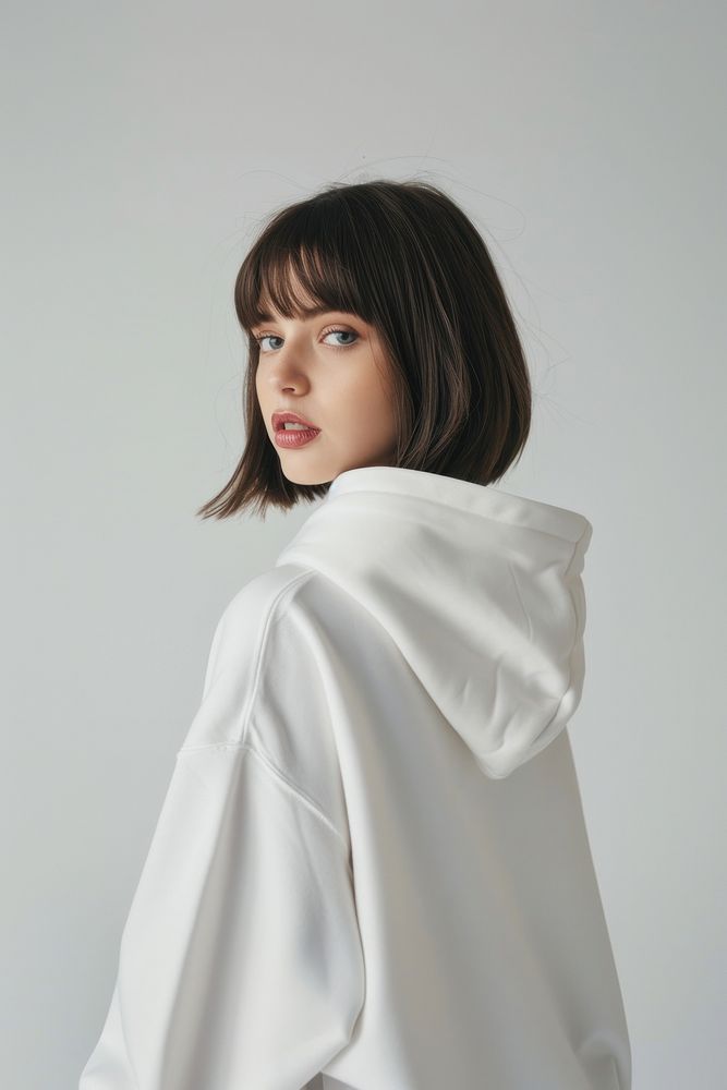 Young woman wears blank white hoodie mockup photography fashion hair.